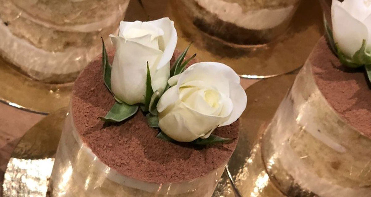fancy chocolate dessert with icing shaped roses